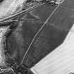 Inveresk: oblique air photograph of Roman temporary camps, enclosure, soilmarks, long cist cemetery and mineral railway