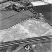 Westfield, Inveresk, oblique aerial view, taken from the S, centred on the cropmarks of ditches of the W side of the cursus monument, crossed by the cropmark of a dismantled mineral railway.