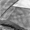 Brunstane, oblique aerial view, taken from the WNW, centred on cropmarks including those of coal pits, and a shaft is visible in the centre left of the photograph.