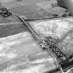 Westfield, Inveresk, oblique aerial view, taken from the N, centred on the cropmarks of a cursus monument. The cursus is bisected by the cropmark of a dismantled mineral railway. Cropmarks of a field-system are visible in the bottom half.