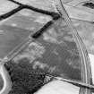 Monkton Lodge and Castlesteads, oblique aerial view, taken from the NNE, centred on a series of linear cropmarks and pits. Cropmarks of two pit-alignments are visible in the top half of the photograph.