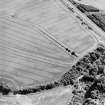Oblique aerial view centred on the cropmarks of the mineral railway and Roman temporary camp, taken from the WSW.