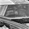 East Field, Inveresk, oblique aerial view, taken from the NW, centred on a series of cropmarks and showing a pit alignment in the centre right of the photograph.