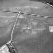 Brunstane, oblique aerial view, taken from the SW, centred on the cropmarks of an enclosure, coal pits and shaft, a possible enclosure and rig.  Other cropmarks are also visible.