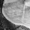 Oblique aerial view centred on the cropmarks of the pit-alignment, palisaded settlement, ring-ditches and enclosures, taken from the NE.