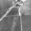 Dolphingstone, oblique aerial view, taken from the SW, centred on a series of cropmarks.