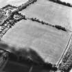 Philip Haugh, oblique aerial view, taken from the N, centred on cropmarks of a settlement.