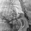 Fairneylees, oblique aerial view, taken from the NW, centred on the cropmark of a scooped settlement.