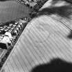 Wester Pencaitland, oblique aerial view, taken from the W, centred on the cropmarks of a fort. Pencaitland Maltings is visible in the left half of the photograph.