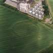 Oblique aerial view centred on the cropmarks of the fort with maltings adjacent, taken from the SSE.