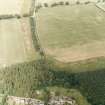 Oblique aerial photograph of Fala Dam, taken from the S, centred on the cropmarks of a Roman temporary camp.