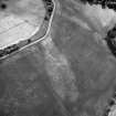 Saultoun Home Farm, oblique aerial view taken from the NE, centred on the cropmarks of an enclosure and pit-alignments.