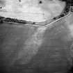 Saultoun Home Farm, oblique aerial view taken from the NE, centred on the cropmarks of an enclosure and pit-alignments.