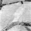 Saltoun Home Farm, oblique aerial view, taken from the SW, centred on the cropmarks of an enclosure and a pit-alignment.