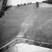 Saultoun Home Farm, oblique aerial view taken from the SW, centred on the cropmarks of an enclosure and pit-alignments.