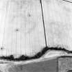 Oblique aerial view centred on the cropmarks of the ring-ditch and possible enclosure, taken from the SW.