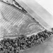 Redhouse Dean, oblique aerial view, taken from the NW, centred on the cropmarks of a fort.