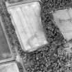 Oblique aerial view centred on the possible geological cropmarks with lodge, cottage and walled garden adjacent, taken from the WSW.