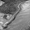 Oblique aerial view of Gosford Sands centred on the remains of anti-tank blocks, taken from the NW.