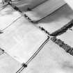 Oblique aerial view centred on the cropmarks of the settlement and trackway with field boundary adjacent, taken from the E.