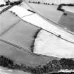 Newstead, oblique aerial view, taken from the NNW, centred on the cropmarks of the Roman Fort.