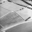Oblique aerial view centred on the cropmarks of the eastern and southern annexes of the Roman Fort, taken from the SW.