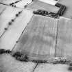 Oblique aerial view centred on the cropmarks of the Roman temporary camps, taken from the SE.