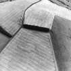 Oblique aerial view centred on the cropmarks of the settlement and enclosure, taken from the NW.