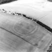 Oblique aerial view centred on the soilmarks of the fort, taken from the NE.