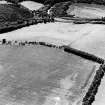 Oblique aerial view of Birkenside Hill centred on the cropmarks of a fort, enlcosures and linear cropmarks, taken from the ENE.