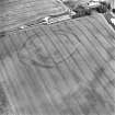 Oblique aerial view centred on the cropmarks of the fort, taken from the S.