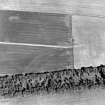 Oblique aerial view of Camp Strip centred on the cropmarks of a possible fort, taken from the W.