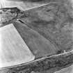 Black Castle, oblique aerial view, taken from the SW, centred on the cropmarks of a pit-alignment. Part of a fort is visible in the top left-hand corner of the photograph.