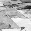 Oblique aerial view centred on the cropmarks of the pit-alignments with fort adjacent, taken from the S.