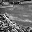 Oblique aerial view of cropmarks including linear croparks and pits, taken from the SSE.