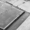 Oblique aerial view of Fortoun Bank centred on the cropmarks of a possible enclosure, taken from the NNE.