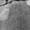 Oblique aerial view of Nether Hailes centred on the cropmark of an enclosure.  Taken from the SW.