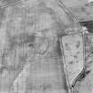 Oblique aerial view centred on the cropmarks of the settlement and field boundaries, taken from the ENE.