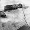 Oblique aerial view centred on the cropmarks of the settlements, taken from the E.