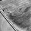 Oblique aerial view centred on the cropmarks of the settlement, taken from the SE.