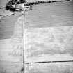 Oblique aerial view centred on the cropmarks of the ring-ditches and linear cropmarks, taken from the NNW.