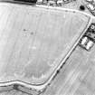 Oblique aerial view centred on the cropmarks of the possible field boundaries and linear cropmarks, taken from the WNW.