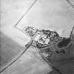 Oblique aerial view centred on the cropmarks of the settlements and enclosure, taken from the SSW.