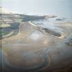 Oblique aerial view centred on the remains of the embankment of the failed land reclamation, taken from the SSW.