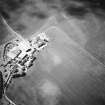 Oblique aerial view centred on the cropmarks of the settlements and other cropmarks, taken from the ESE.