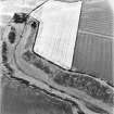 Pleasants, oblique aerial view, taken from the SE, centred on the cropmarks of a fort.