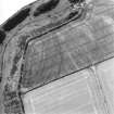 Oblique aerial view centred on the cropmarks of the fort, taken from the E.