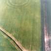 Oblique aerial view centred on the cropmarks of the field boundaries and cropmarks with fort adjacent, taken from the SE.