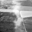 Oblique aerial view centred on the cropmarks of the settlement, taken from the S.