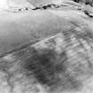 Oblique aerial view centred on the cropmarks of the possible settlement, taken from the E.